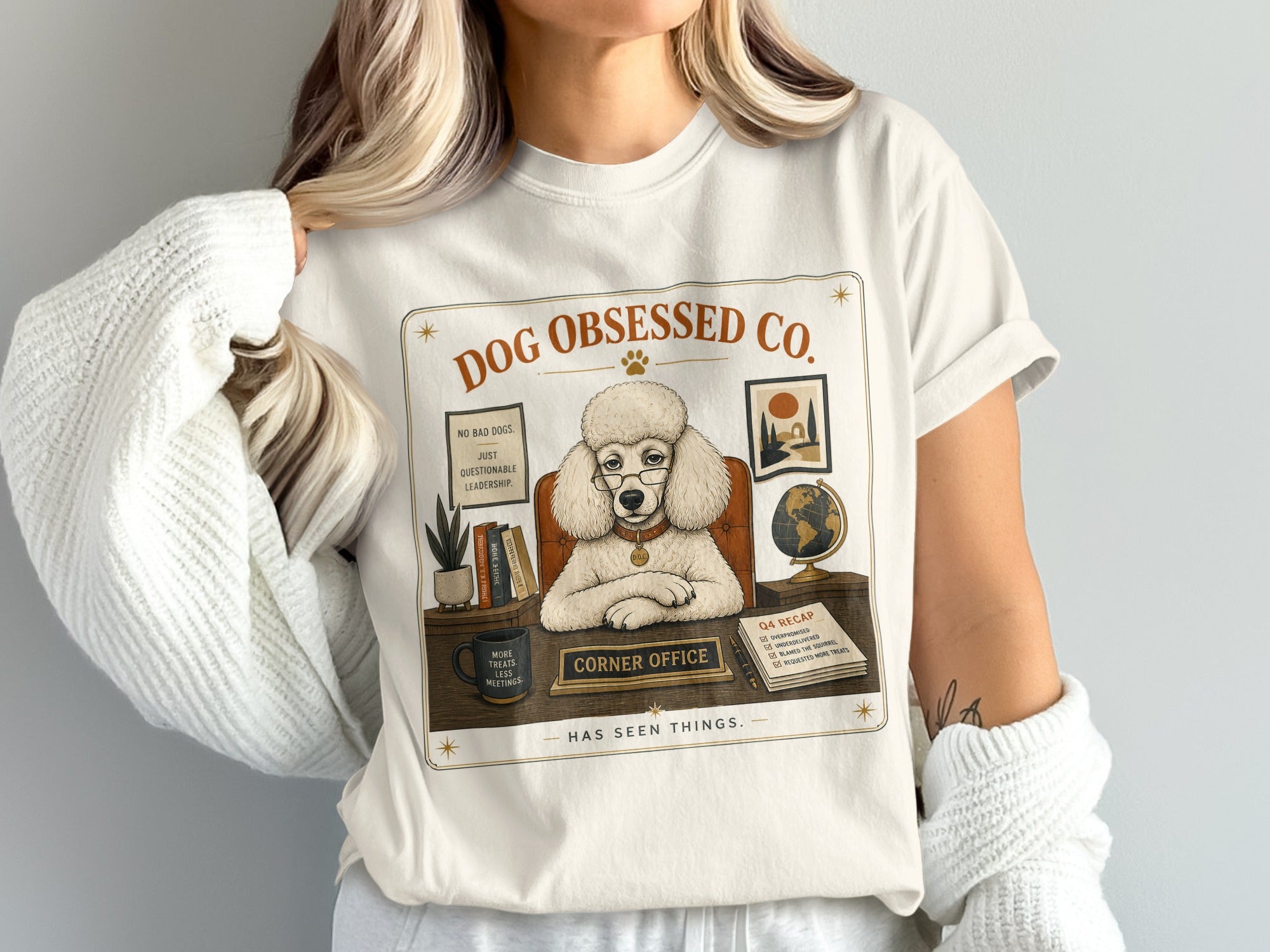 Cream t-shirt with a poodle labeled "Corner Office" sitting at a desk.