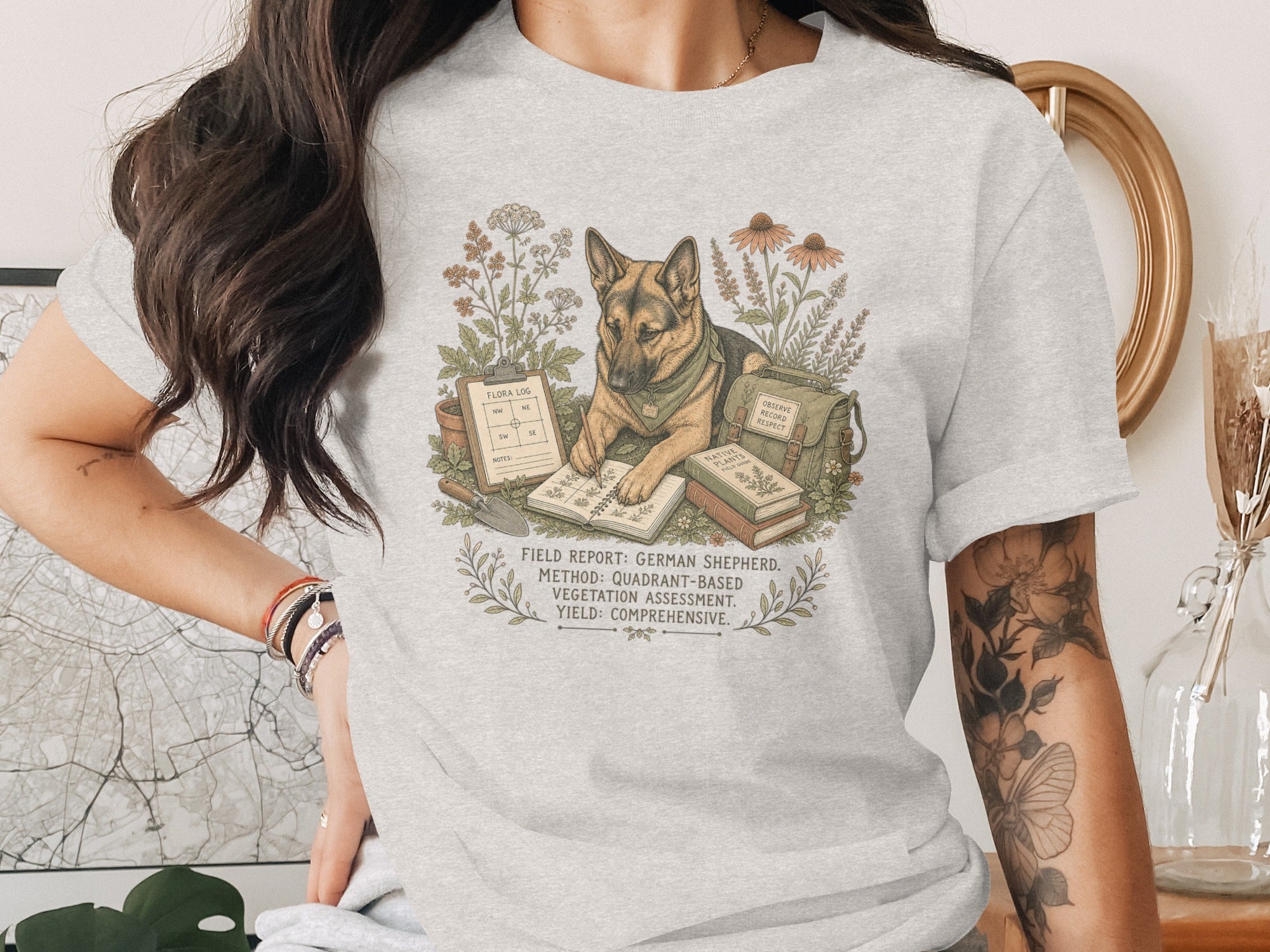 German Shepherd in a garden scene with field notes, plants, and books.