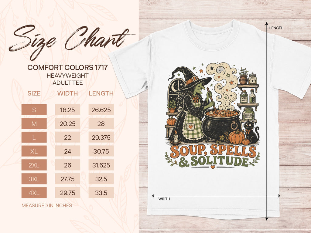 White t-shirt with witch graphic and "Soup, Spells & Solitude" text, size chart on left.