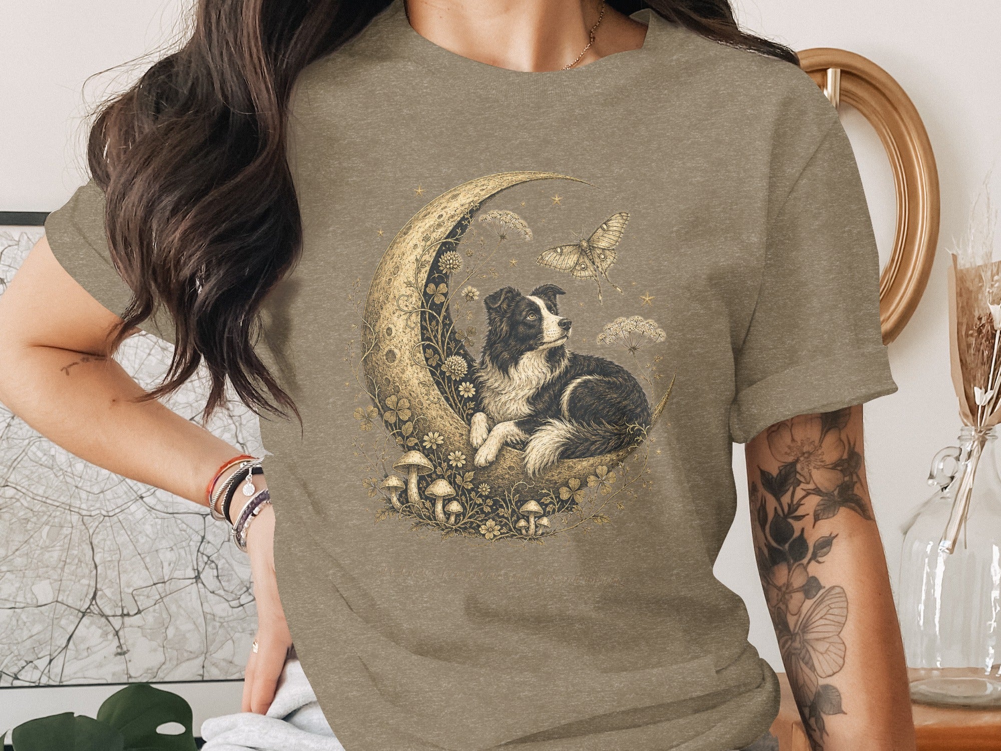 Border collie on a crescent moon with mushrooms, flowers, stars, and a butterfly.