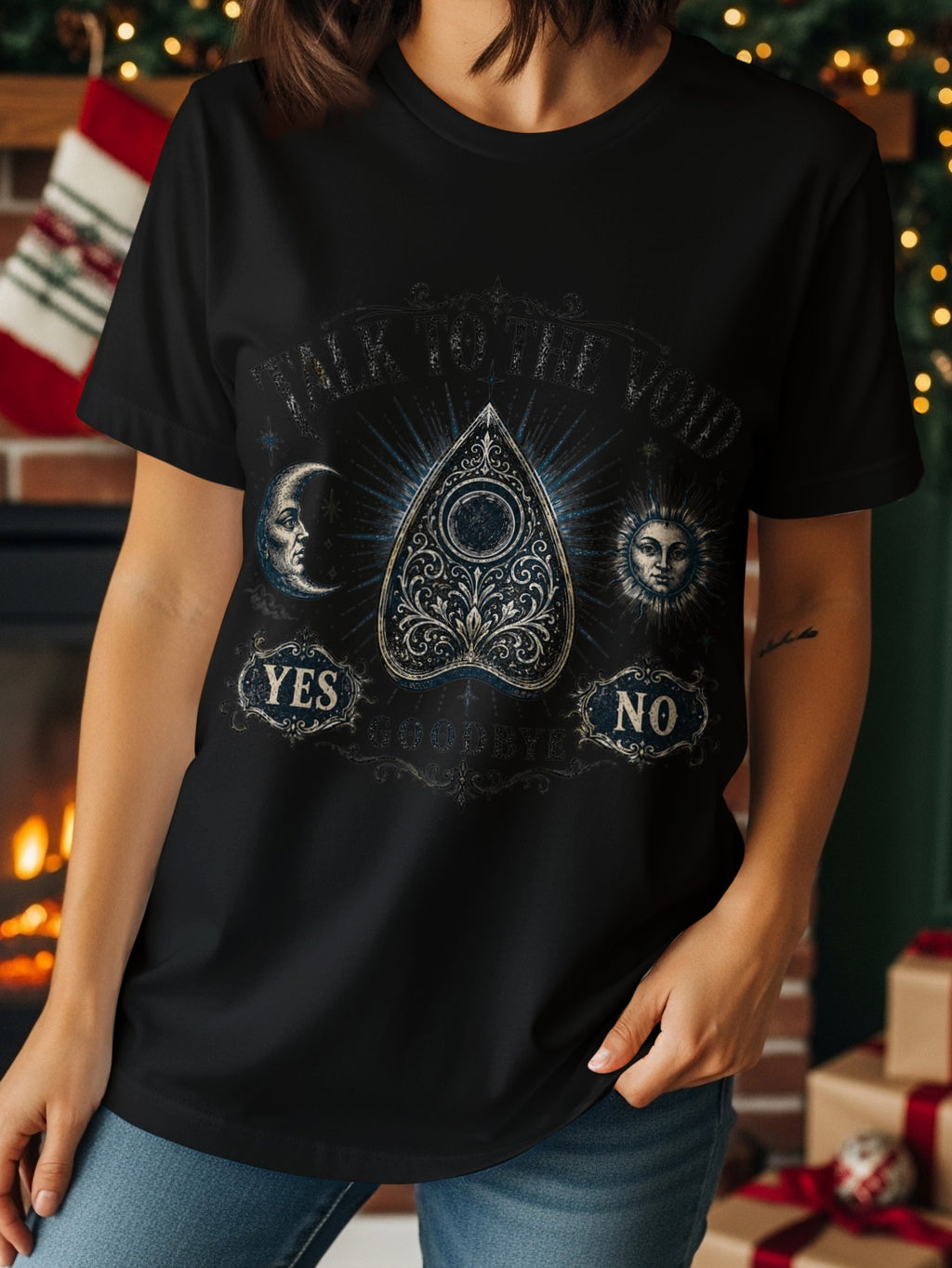 Black t-shirt with a ouija board design featuring moon, sun, yes, no, and goodbye.