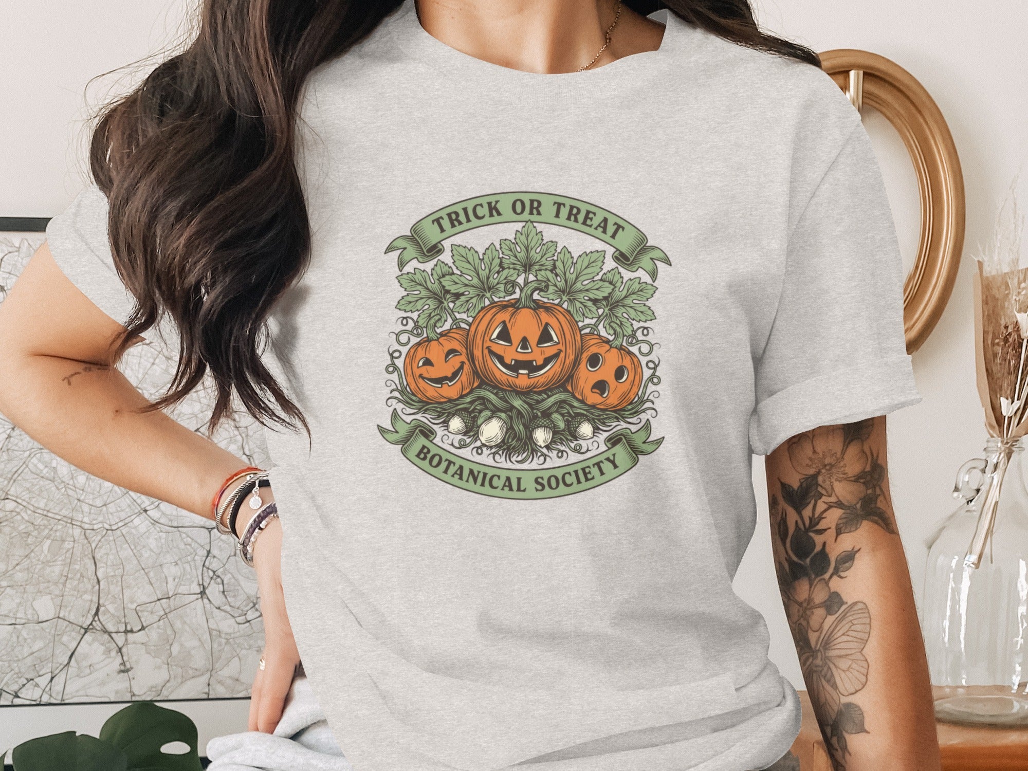 Gray t-shirt with "Trick or Treat Botanical Society" and pumpkin graphic.