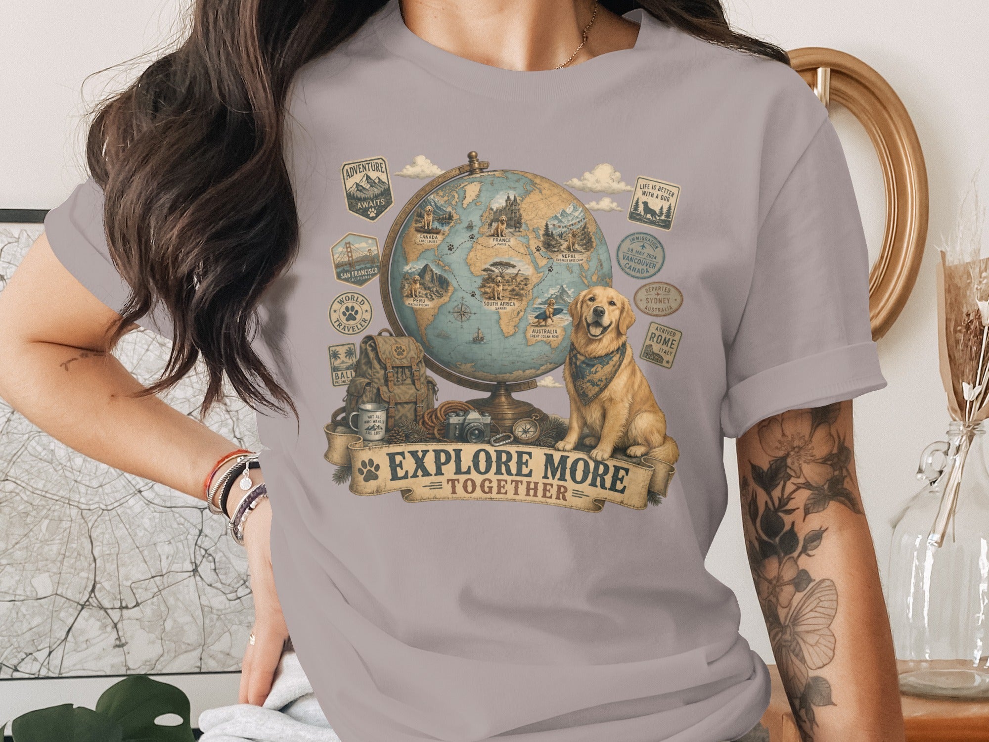 Golden retriever with travel decals around a globe, reading "Explore More Together".