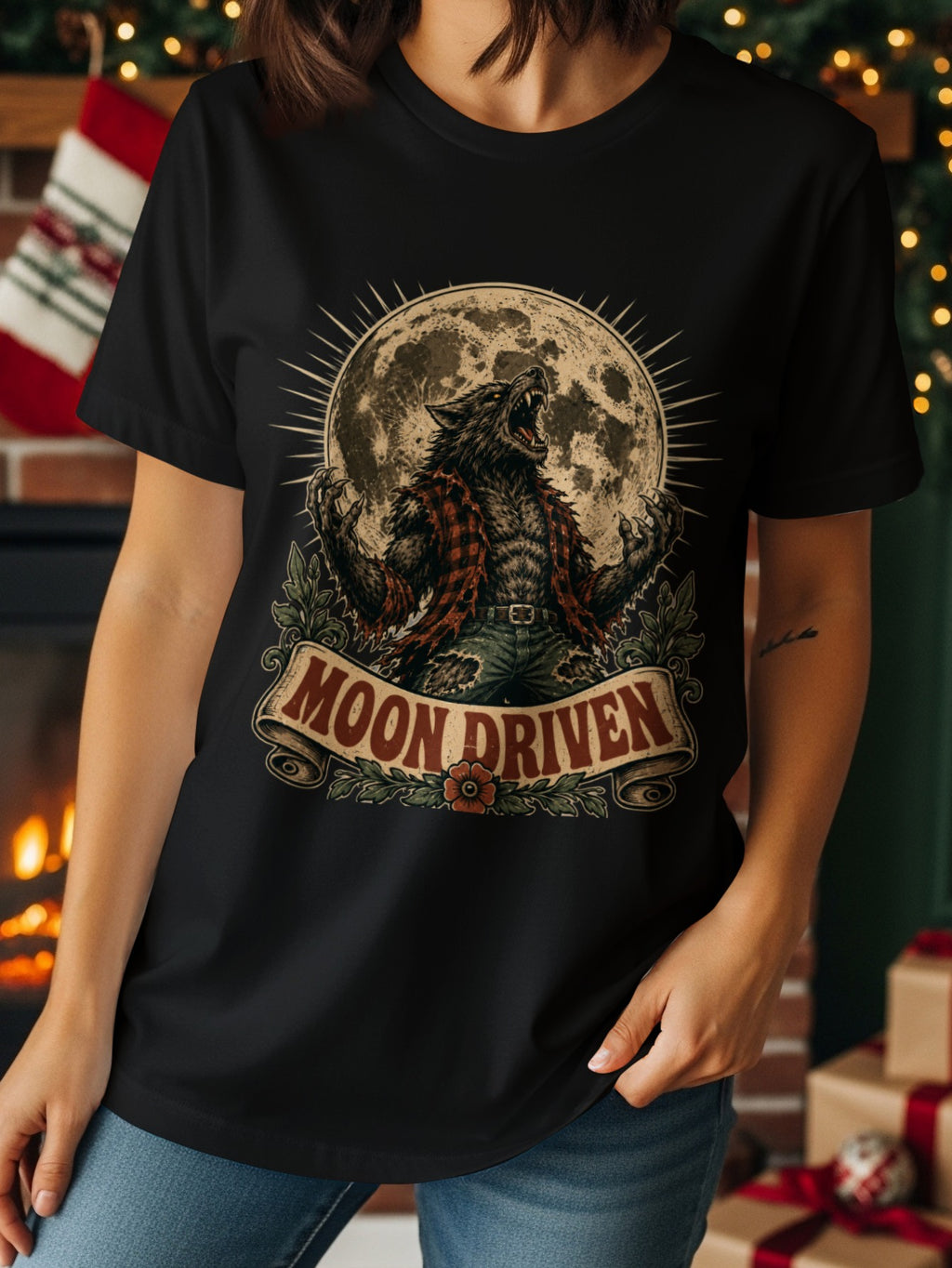Black t-shirt graphic with a werewolf howling at the full moon, text "MOON DRIVEN".