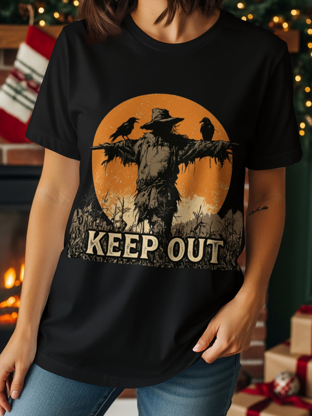 Scarecrow with two crows and "KEEP OUT" text on a black t-shirt.
