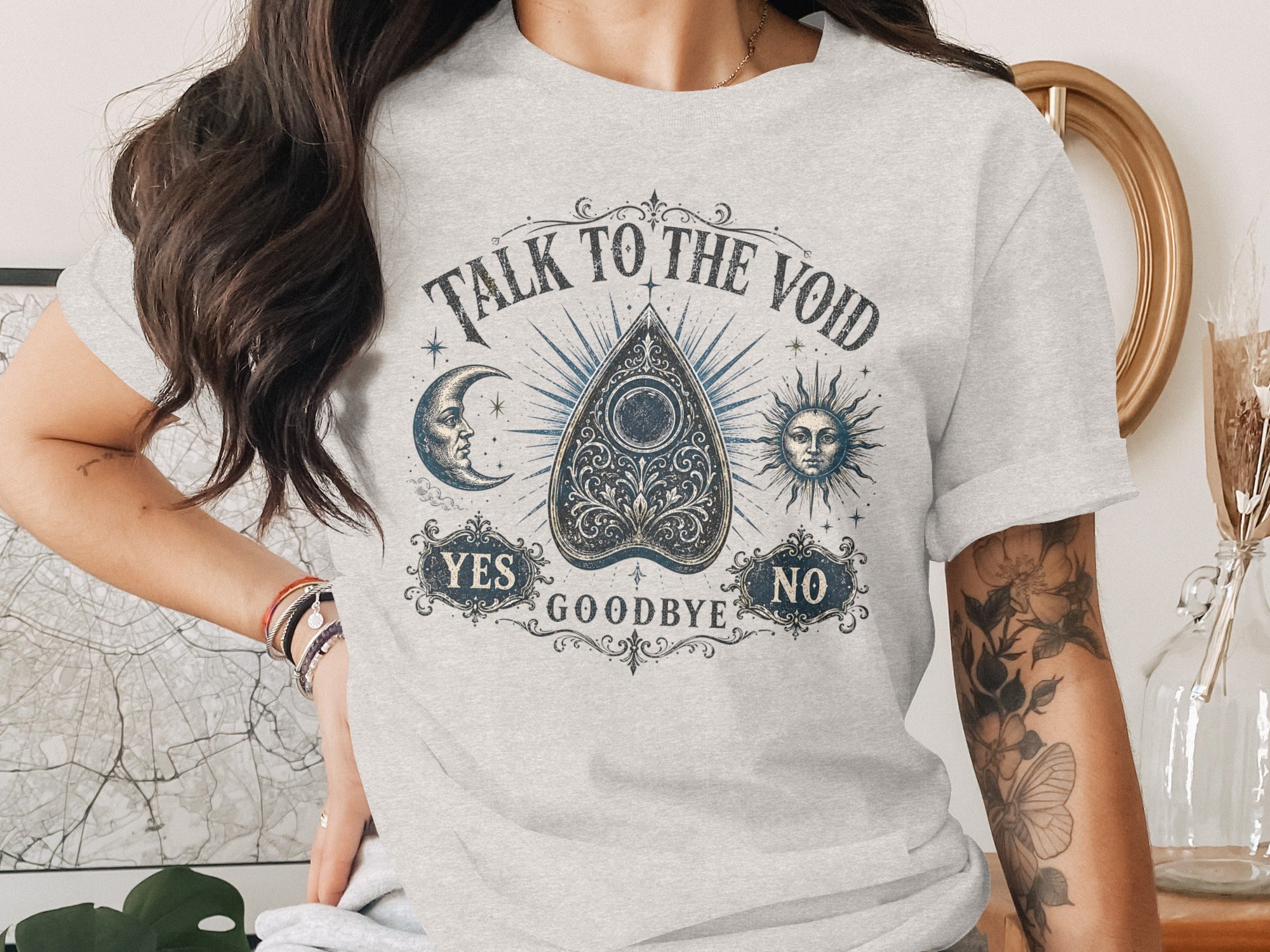 Ouija board graphic with "Talk to the Void" text and sun, moon, yes, no, and goodbye.