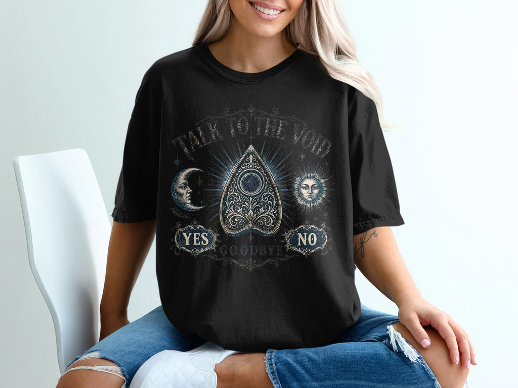 Black t-shirt with "Talk to the Void" and ouija board design.