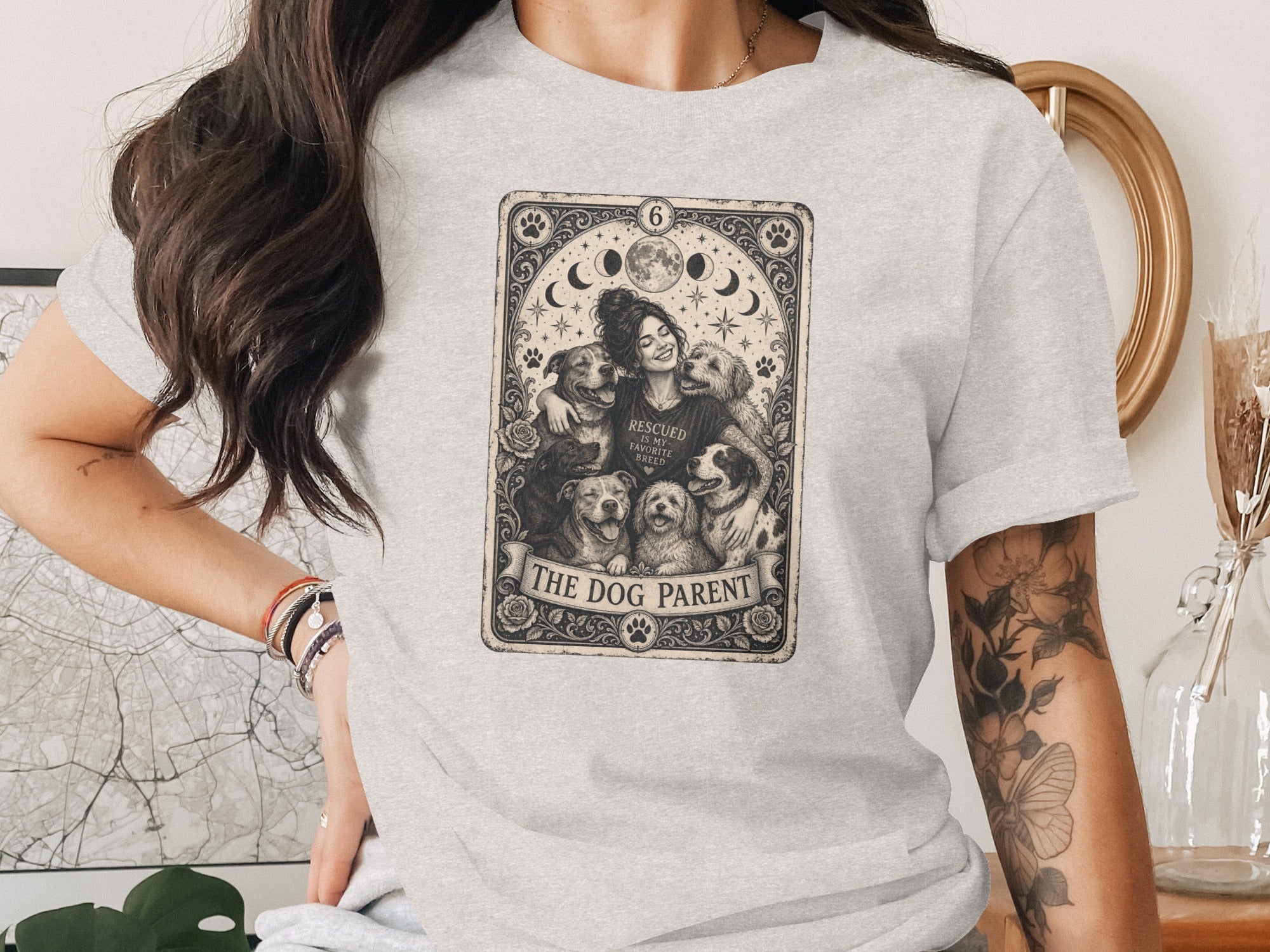T-shirt graphic shows woman embracing dogs, reads "The Dog Parent."