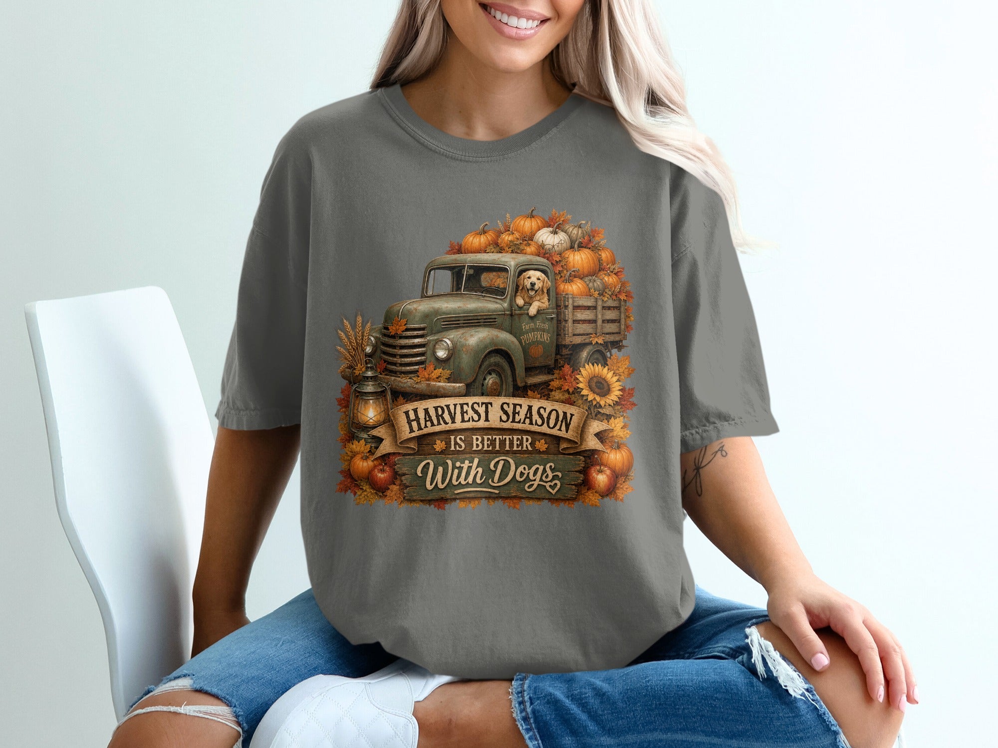 Grey t-shirt with vintage truck, pumpkins, dog, and text "Harvest Season Is Better With Dogs."