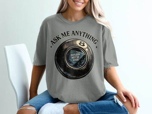 Gray t-shirt with a vintage magic 8 ball graphic reading "ASK ME ANYTHING."