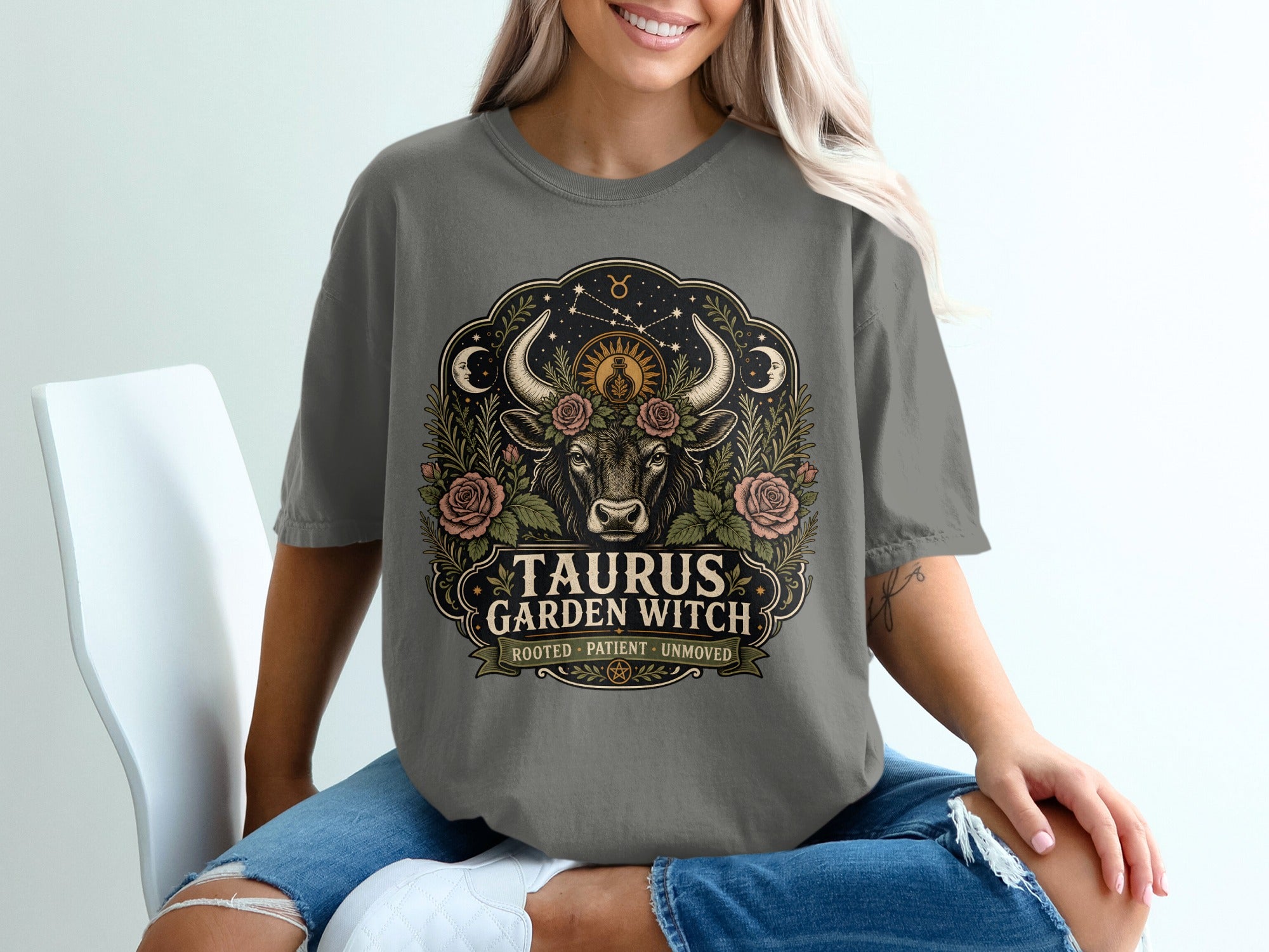 Gray t-shirt with Taurus Garden Witch design featuring bull, roses, moon and stars.