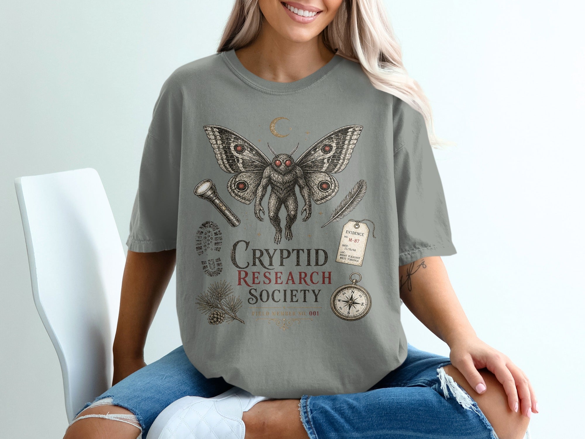 Mothman design with "Cryptid Research Society" text and related vintage illustrations.
