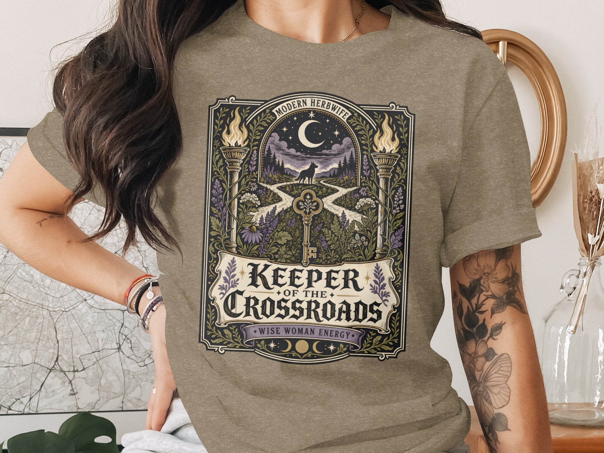 Shirt with "Keeper of the Crossroads" graphic and a wolf under a moon.