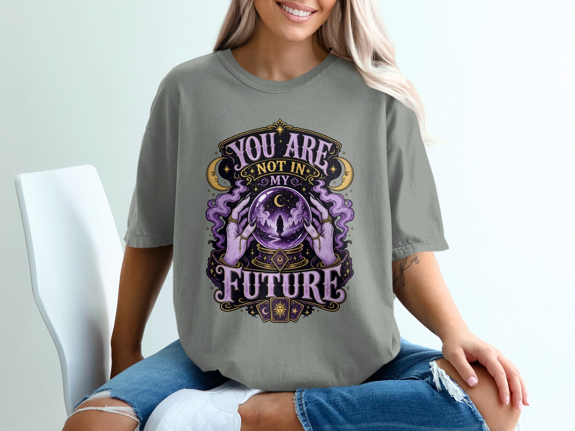 T-shirt graphic with crystal ball, hands, moons, and text "YOU ARE NOT IN MY FUTURE".
