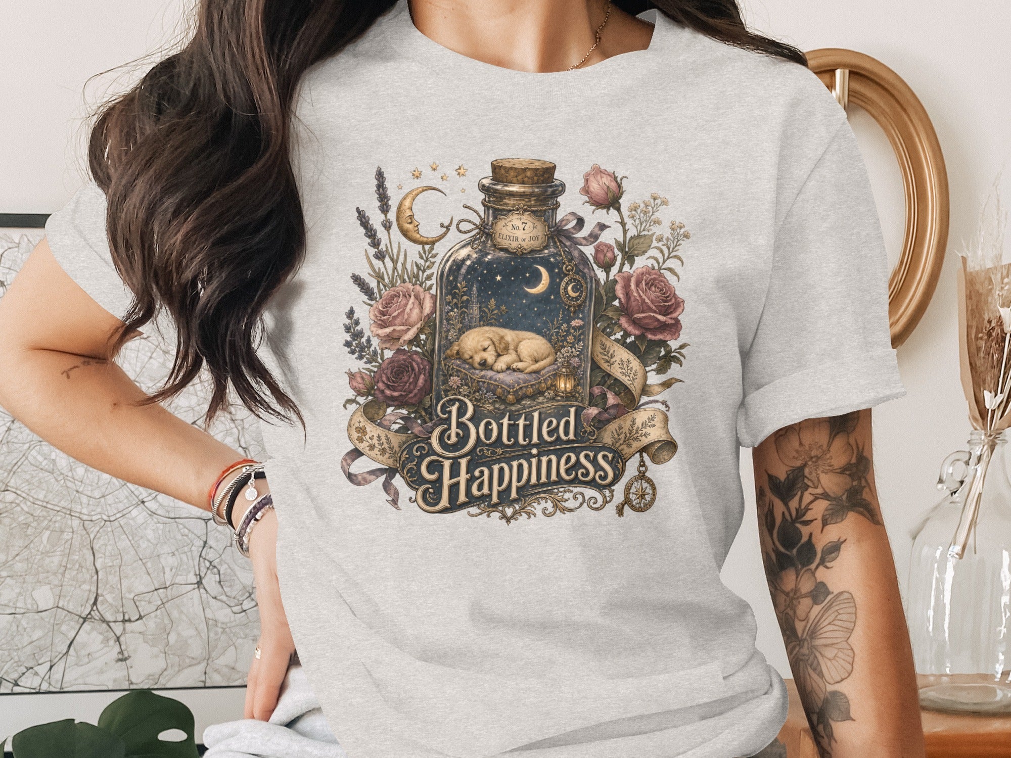 Gray t-shirt with "Bottled Happiness" text and a bottle containing a sleeping puppy.