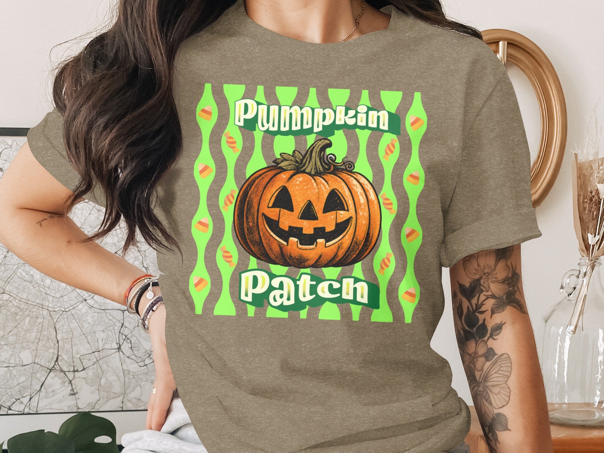 T-shirt with a jack-o'-lantern and candy corn design saying "Pumpkin Patch."