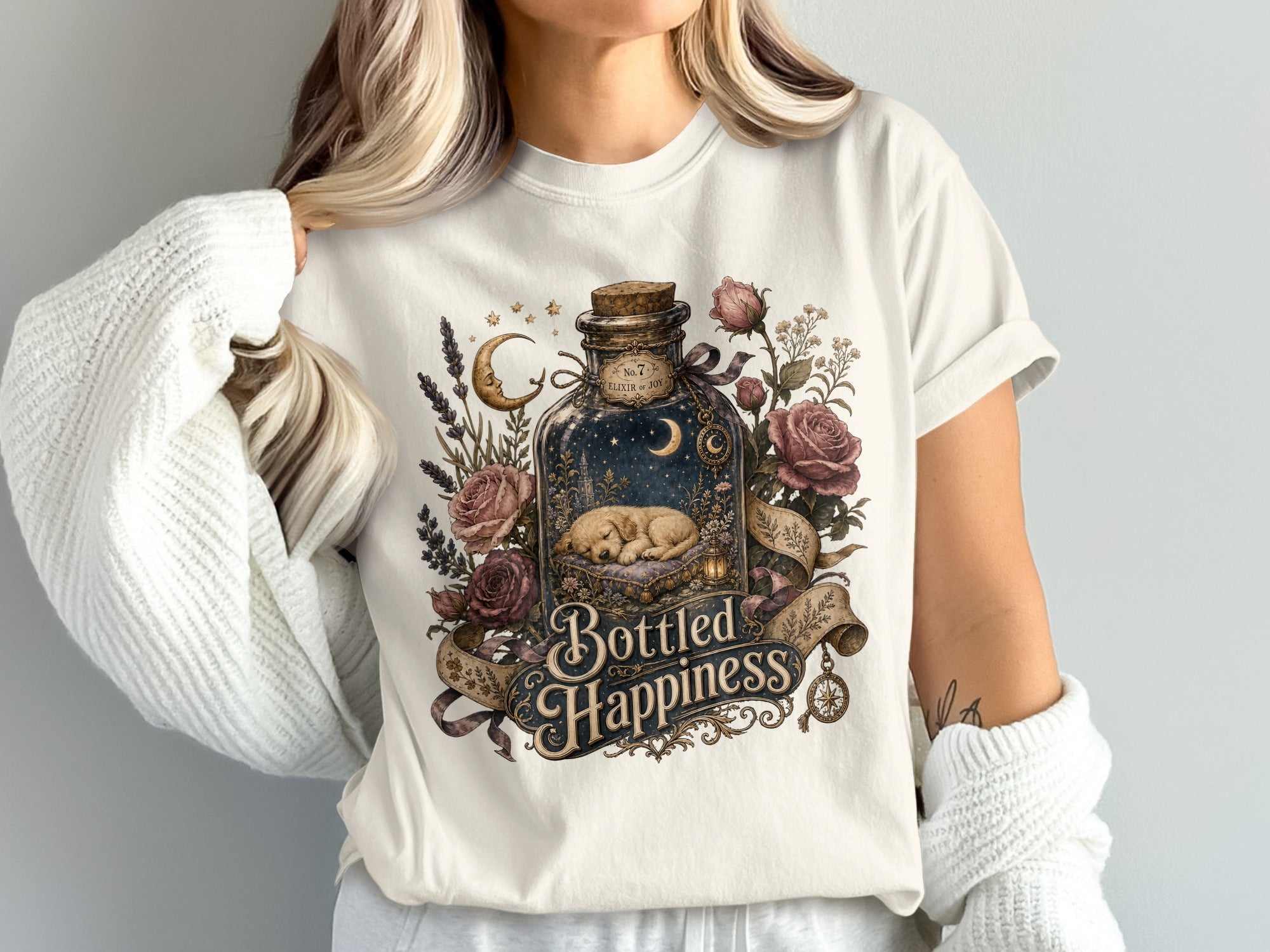 Bottled Happiness graphic with sleeping puppy in ornate bottle surrounded by roses.