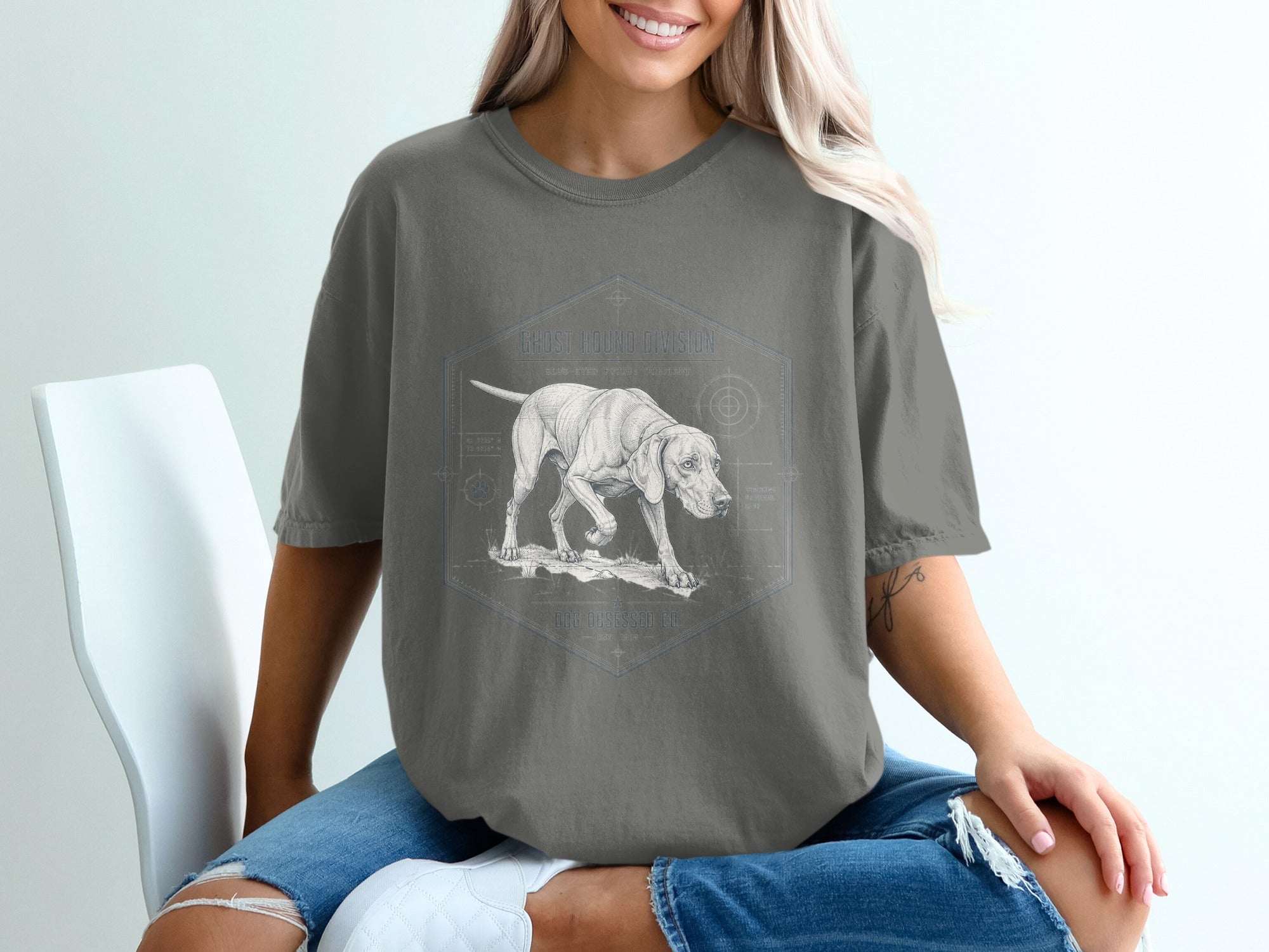 T-shirt with a sketch of a dog, compass, and text "Ghost Hound Division."