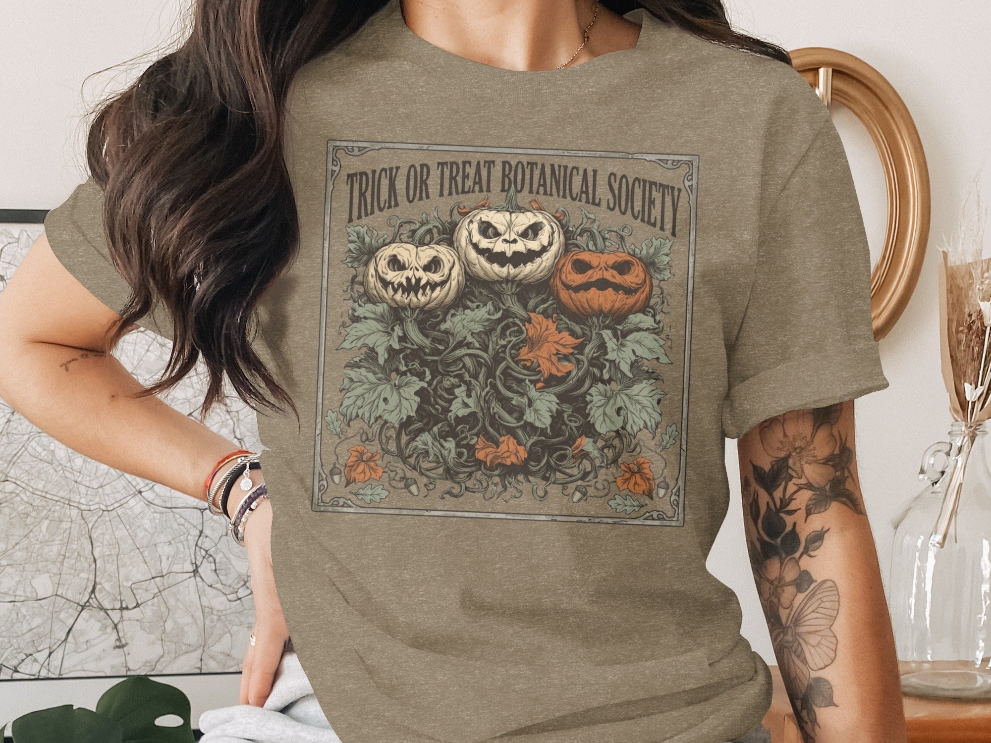 T-shirt with jack-o'-lanterns and "Trick or Treat Botanical Society" text.