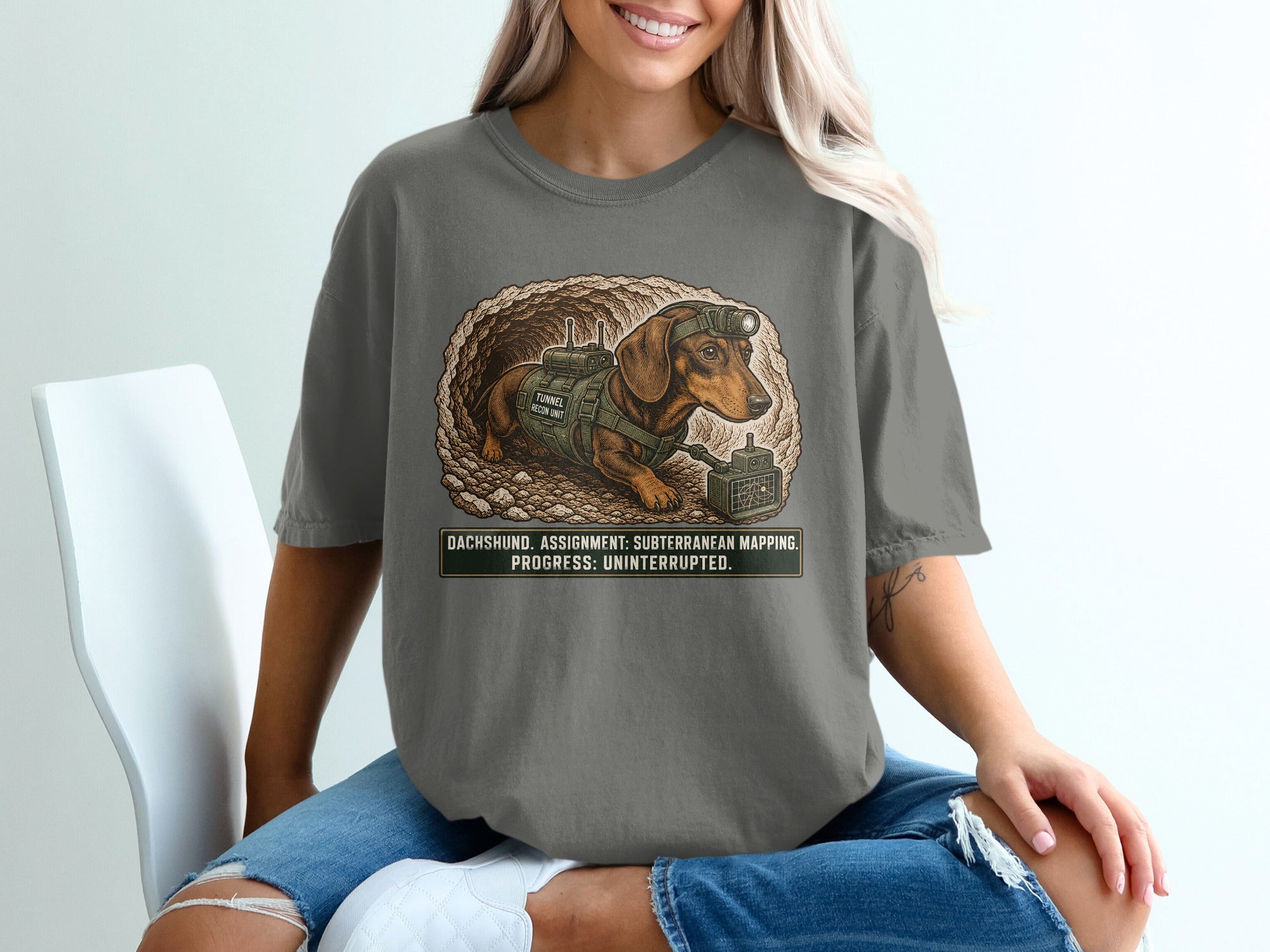 Dachshund in tunnel mapping gear with text: Dachshund. Assignment: Subterranean Mapping. Progress: Uninterrupted.