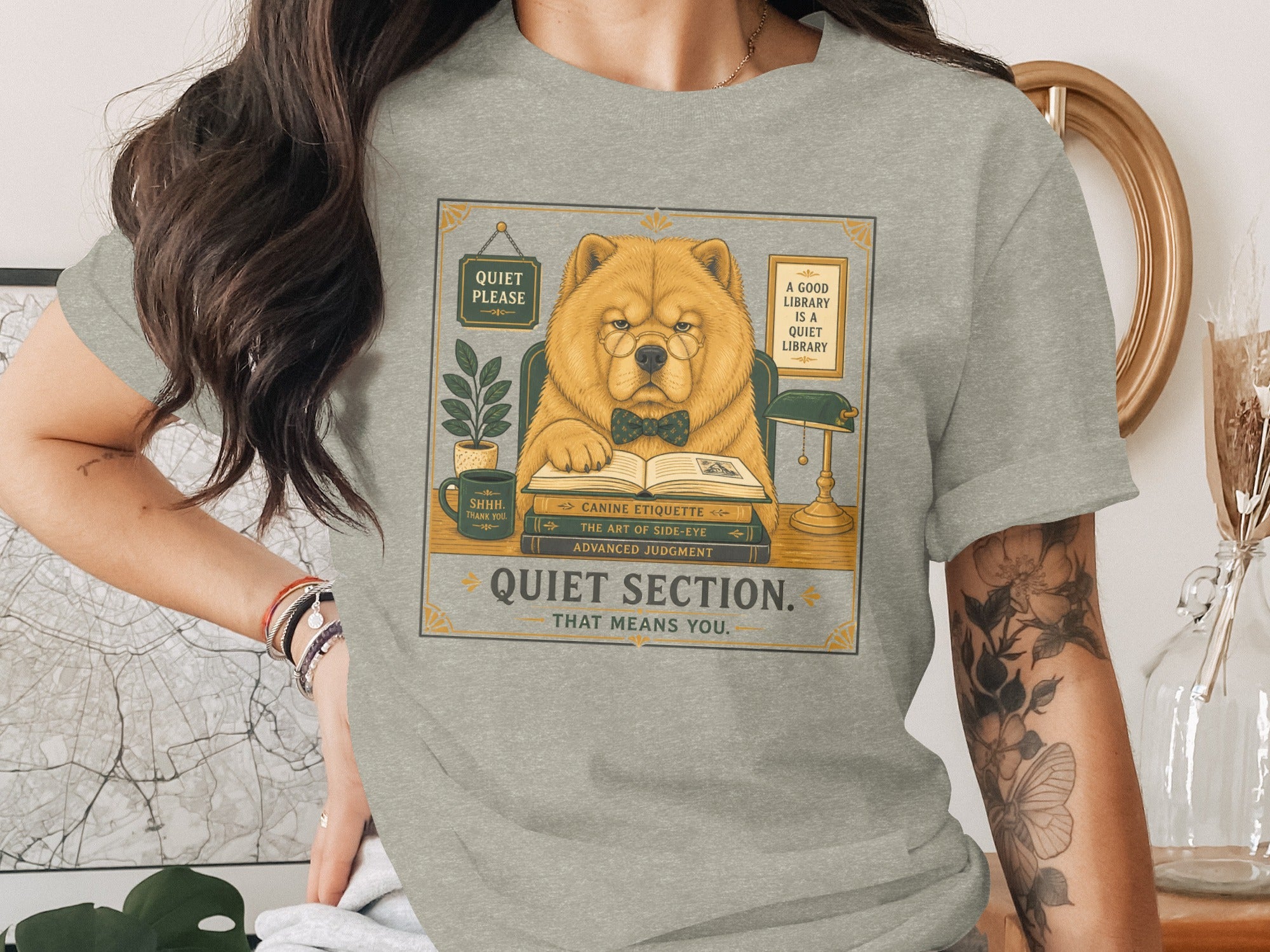 Chow Chow wearing glasses reading books with text "Quiet Section. That Means You."