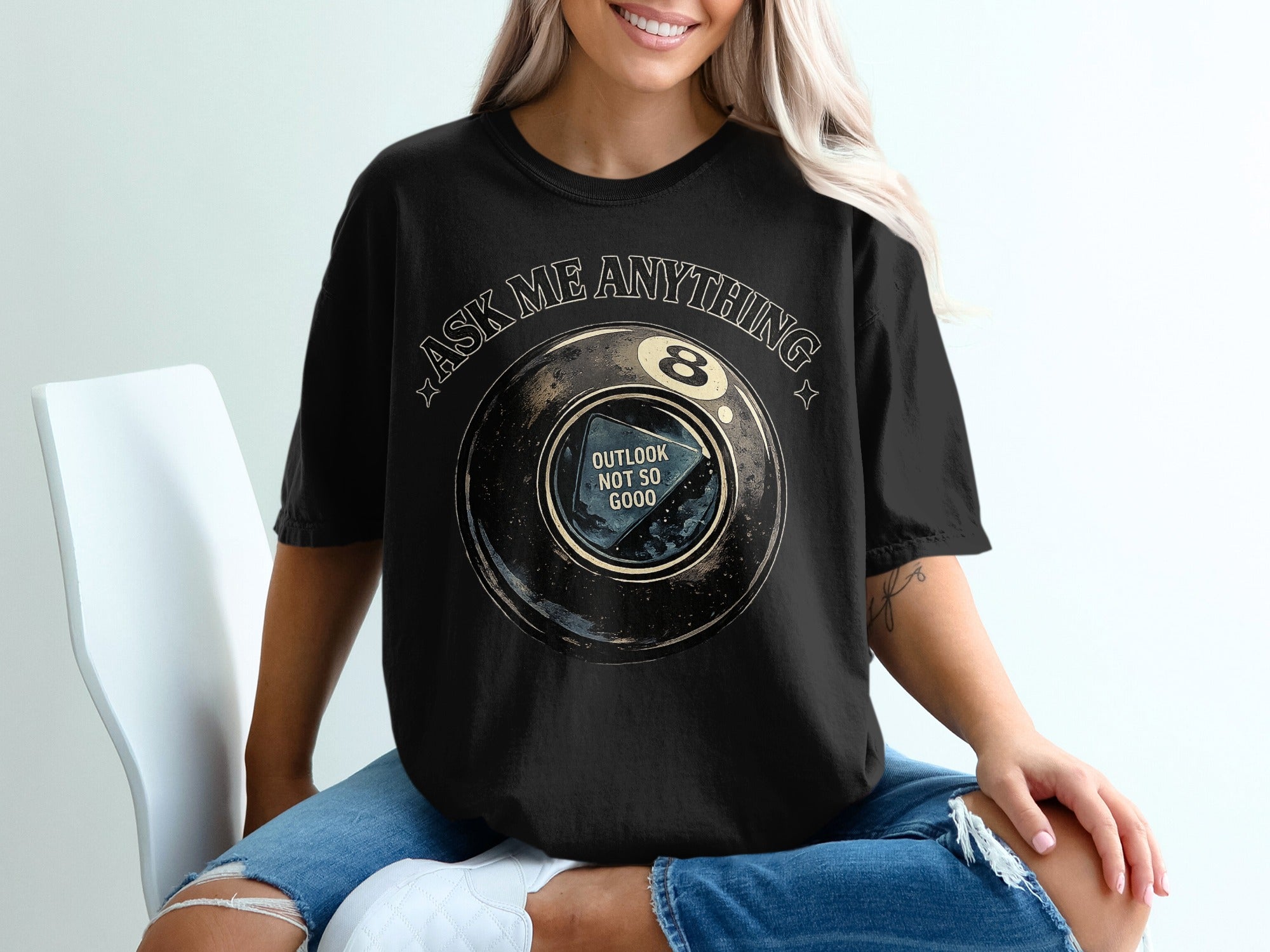 Black t-shirt with "Ask Me Anything" and a 8-ball with "Outlook Not So Good".