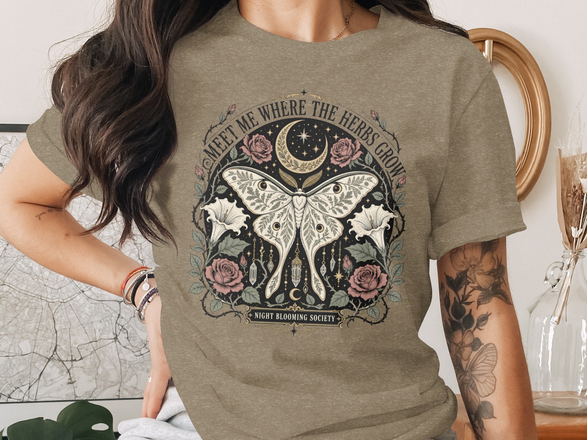 T-shirt with moth, flowers, crescent moon, stars, and text "Night Blooming Society".
