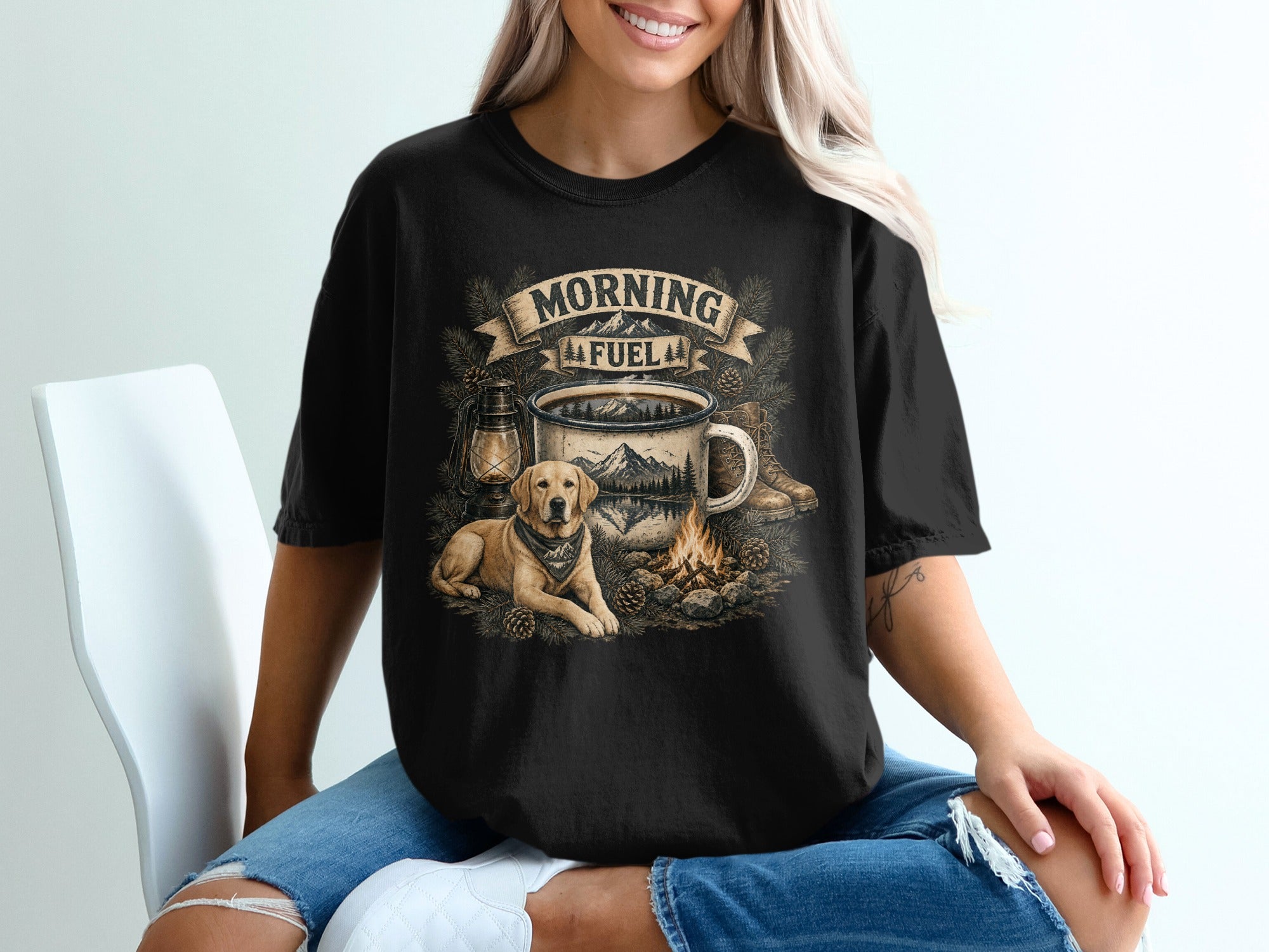 Black t-shirt graphic with a dog, campfire, mountains, and "Morning Fuel" text.