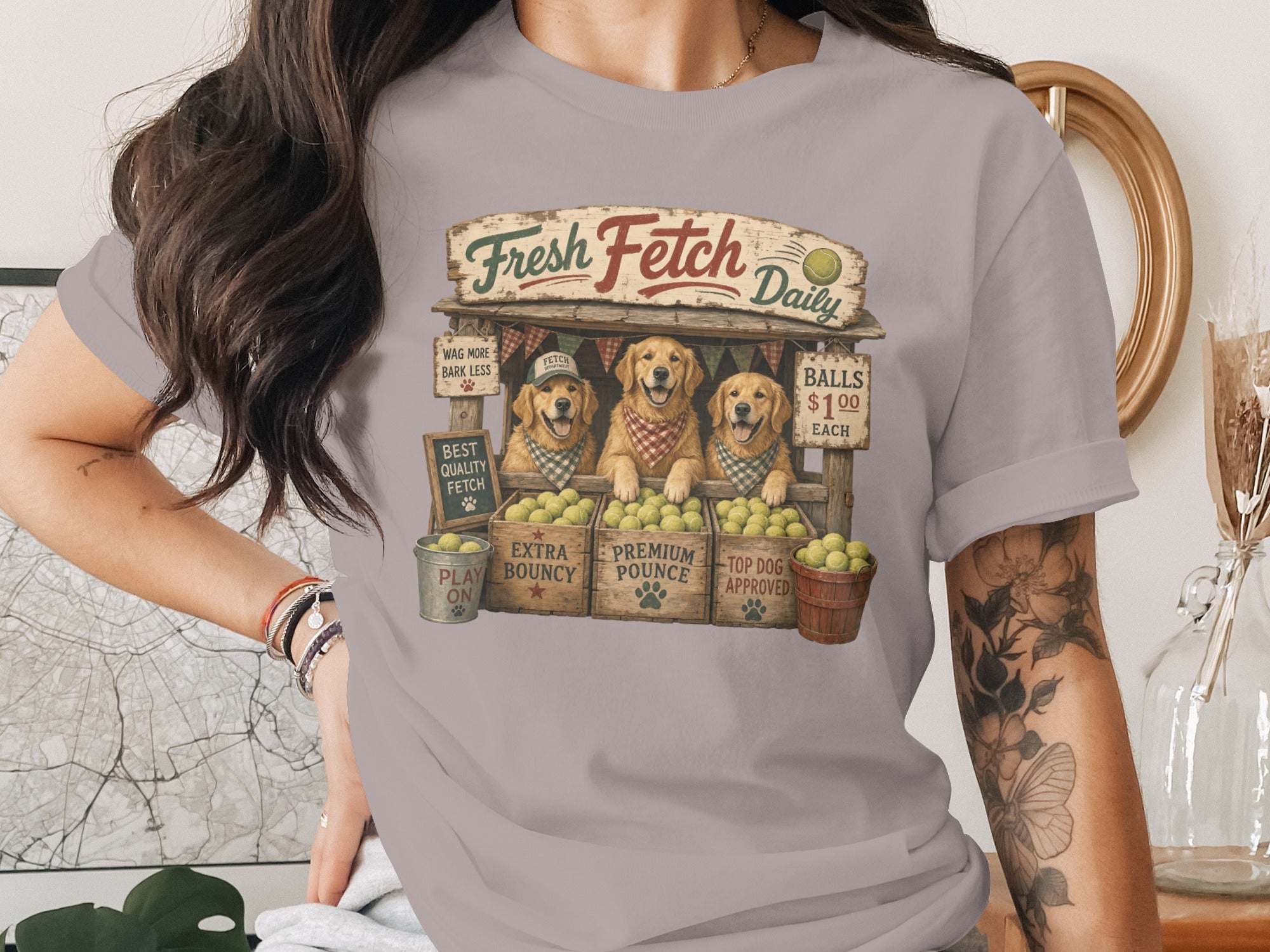 Three Golden Retrievers sell tennis balls at a stand labeled "Fresh Fetch Daily".