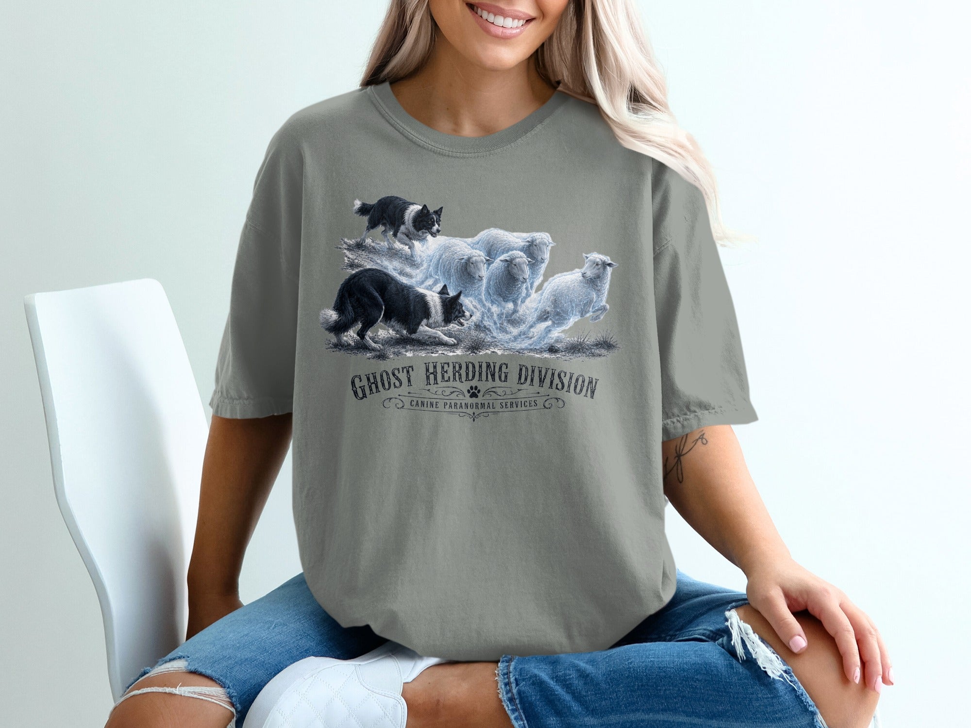 T-shirt graphic: two border collies herding ghostly sheep with text Ghost Herding Division.